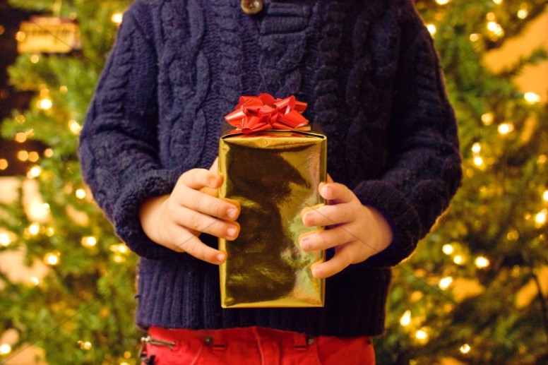 Child With Gift Christian Stock Images