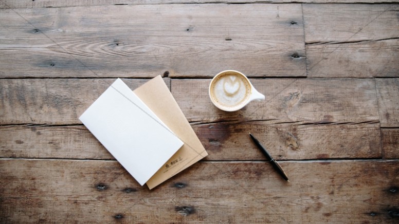 Coffee and Notebook on a Wooden Table Church Stock Photo Thumbnail Showcase